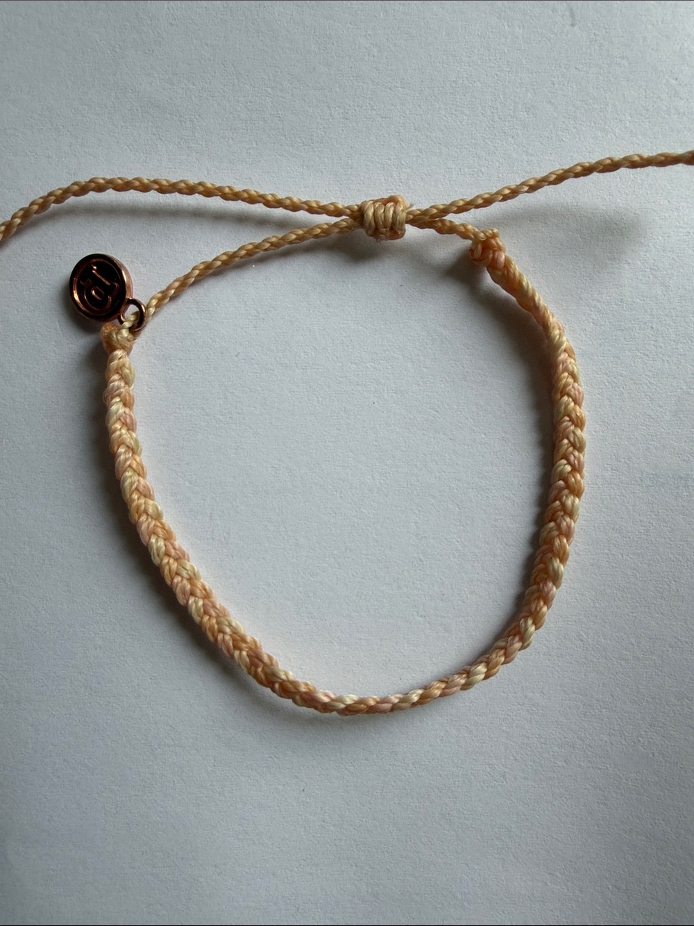 Pura Vida Peach Braided Friendship Bracelet with Rose Gold Tag